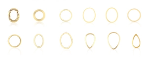 Macro shot of gold star moon nail art studs in assorted hollow geometric shapes