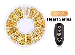 Macro shot of gold alloy nail art studs in a 12-grid wheel case with heart series designs