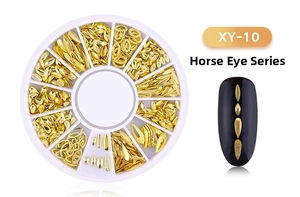 Gold marquise-shaped metal nail art studs set in a white rotating storage wheel