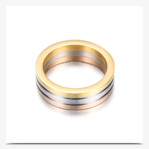 Close-up of triple-layered stainless steel ring in gold, silver, and rose gold finish