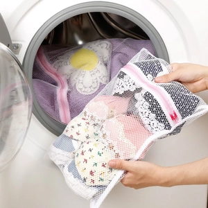 White fine mesh laundry bags with pink zippers for delicate clothes washing