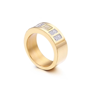 Gold titanium steel ring with central square zircon and round side crystals on white background