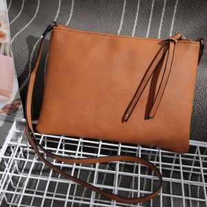 Brown PU leather envelope crossbody bag with side tassel and stylish shoulder strap