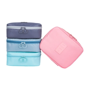 Waterproof nylon travel toiletry bags in four colors with large ring zippers