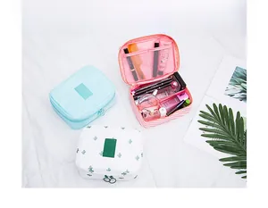 Three-piece set of twill fabric toiletry bags with mesh compartments for travel storage