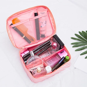 Pink and white striped cosmetic travel bag with adjustable dividers and mesh pockets