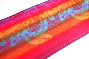 Detailed texture of ethnic jacquard scarf with colorful peacock feather gradient patterns