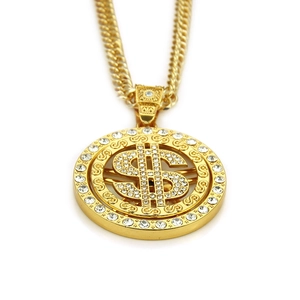 Detail of 18K gold plated hip hop necklace with iced out dollar sign pendant on white background