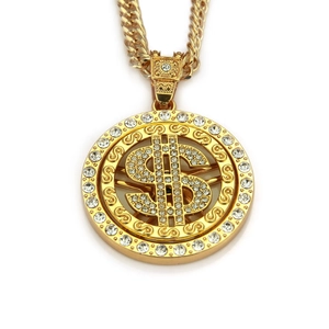 Close-up of golden spinning dollar sign pendant with sparkling diamonds and cuban chain