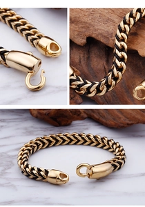 Detail of 18K gold stainless steel hook clasp and black leather braided texture