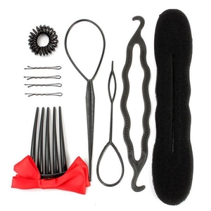 Detailed hair styling tool set with black bun maker, combs, pins and a red bow clip