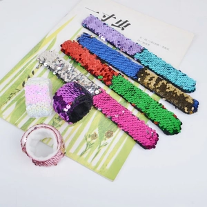 Detail of colorful reversible sequin slap bracelets with soft velvet lining