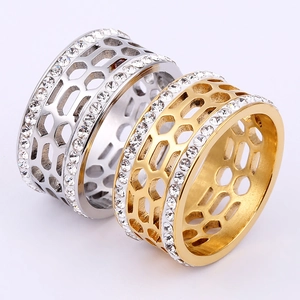 Detailed view of honeycomb hollow rings in gold and silver with double row pavé zircons