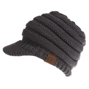 Macro detail of dark grey knit baseball cap with vertical ribbing and C.C leather patch