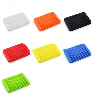 Detail showing various colors of rectangular wave-pattern silicone self-draining soap holders