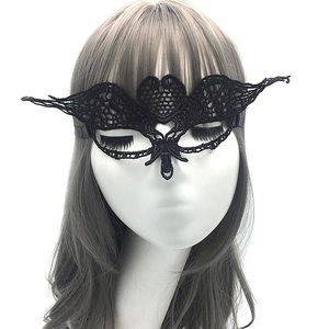 Close-up of elegant black lace butterfly mask on model for masquerade party and Halloween