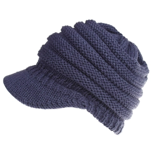 Close-up of deep blue knitted baseball cap featuring thick ribbed texture and curved brim