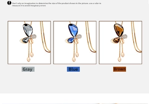 Close-up of butterfly pendants in blue, grey, and brown crystal with rose gold chain