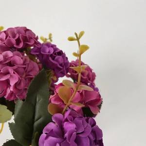 Detailed view of purple and rose red silk hydrangea petals for wedding decor