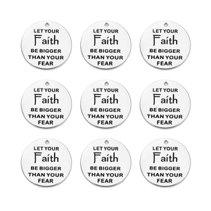 Close-up of 5 round stainless steel pendants with Let Your Faith Be Bigger Than Your Fear