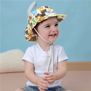 Detail of beige children's sun hat featuring colorful animal prints and adjustable wind cord