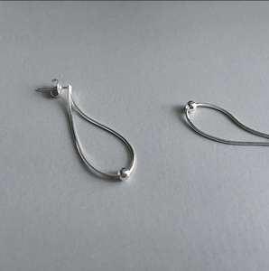 925 silver snake chain drop earrings with round beads shown in a minimalist diagonal view