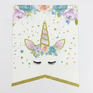 Detail of unicorn themed party tag with floral crown and gold glitter decorative V-shaped border