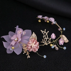 Handmade gold leaf branch hairpiece with purple fabric flowers and delicate pearls