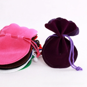 Detailed view of colorful velvet drawstring pouches for jewelry and gift packaging