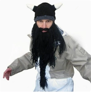 Detail of Viking knit hat with white horns and long black fringe beard for party
