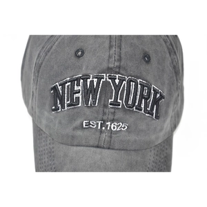 Close-up of New York embroidery on washed charcoal cotton vintage baseball cap