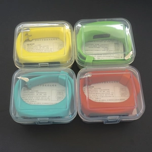 Close-up of colorful silicone pedometer bracelets in transparent retail packaging boxes