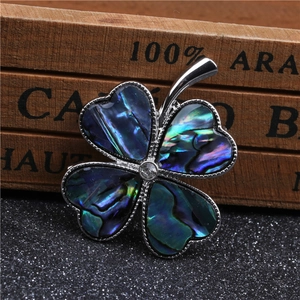 Elegant silver four-leaf clover brooch with colorful abalone shell inlay and rhinestone