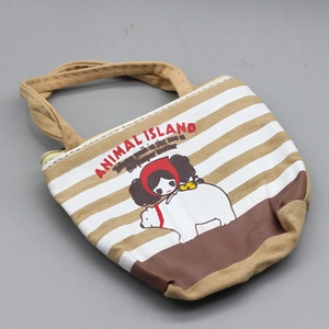 Detailed shot of a striped canvas doll tote bag with animal island polar bear cartoon print