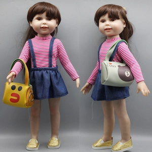 Detail of 18 inch doll outfit with blue denim overall skirt and cute bear crossbody bag