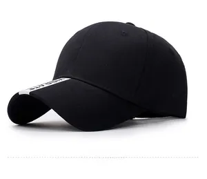 Close-up of black cotton baseball cap showing fabric texture and white brim detail