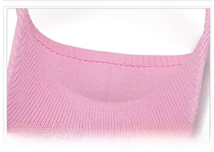 Close-up of pink knitted sun hat showing detailed stitching and fabric texture
