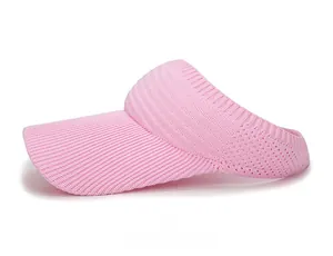 Close-up of pink knitted sun visor showing breathable mesh and striped brim texture