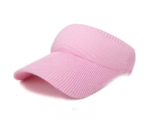 Detailed side view of pink knitted sun visor hat showing breathable mesh texture