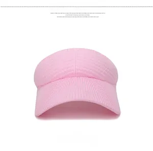 Front view of pink knitted sun visor with detailed vertical ribbed texture pattern