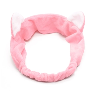 Close-up of pink plush cat ear headband made of soft fleece for face washing