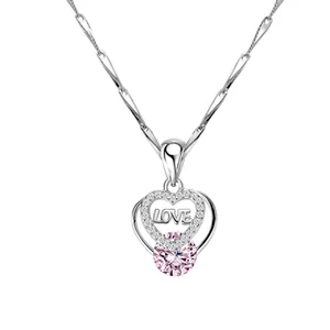Detailed view of S925 silver heart necklace with pink gemstone and LOVE engraving.