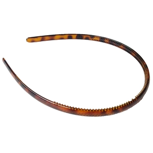 Detail of tortoise shell headband with non-slip teeth for secure and comfortable styling