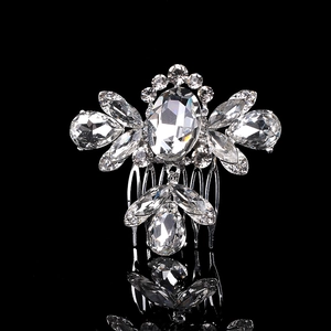 Macro detail of silver bridal hair comb with shimmering crystals and sparkling rhinestones