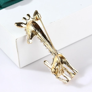 Back view of giraffe animal brooch with gold metal finish and white pearls