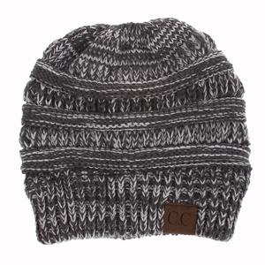 Close-up of thick grey knit winter beanie featuring ribbed trim and brown C.C leather patch