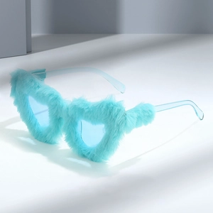 Light blue heart-shaped plush sunglasses with faux fur frames on a minimalist background