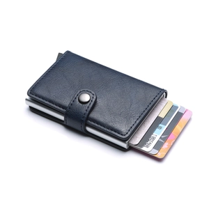 Detail view of deep blue PU leather card holder with automatic aluminum pop-up mechanism