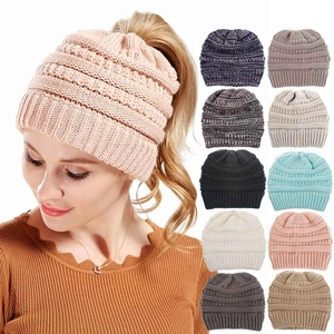Detail of knitted ponytail beanie showing 10 color options and top opening design