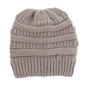Detail of grey knitted beanie showing thick ribbed texture and warm winter wool fabric